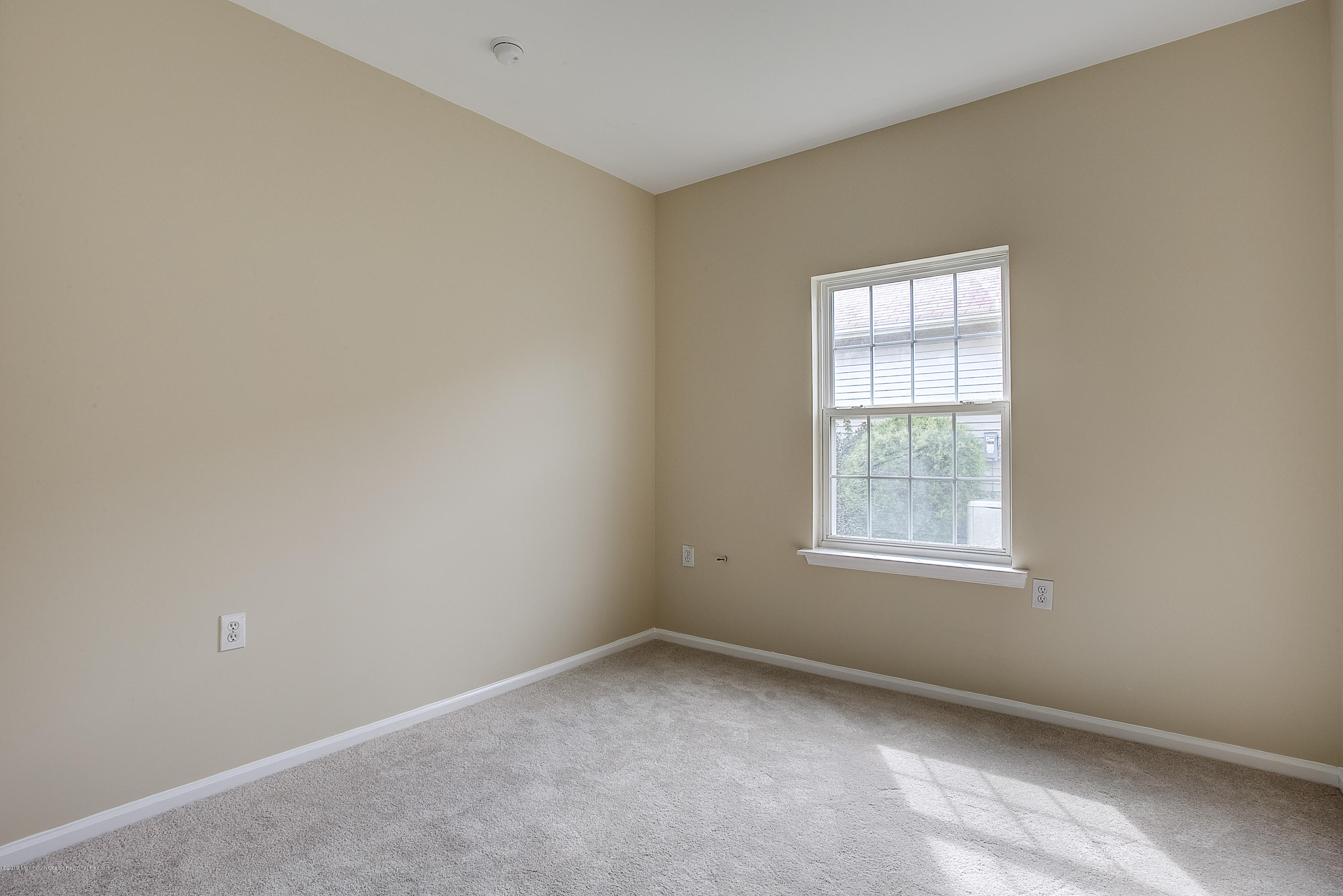 25 Torino Road Manchester Township, NJ 08759 - Photo 17 of 31 an empty room with a window