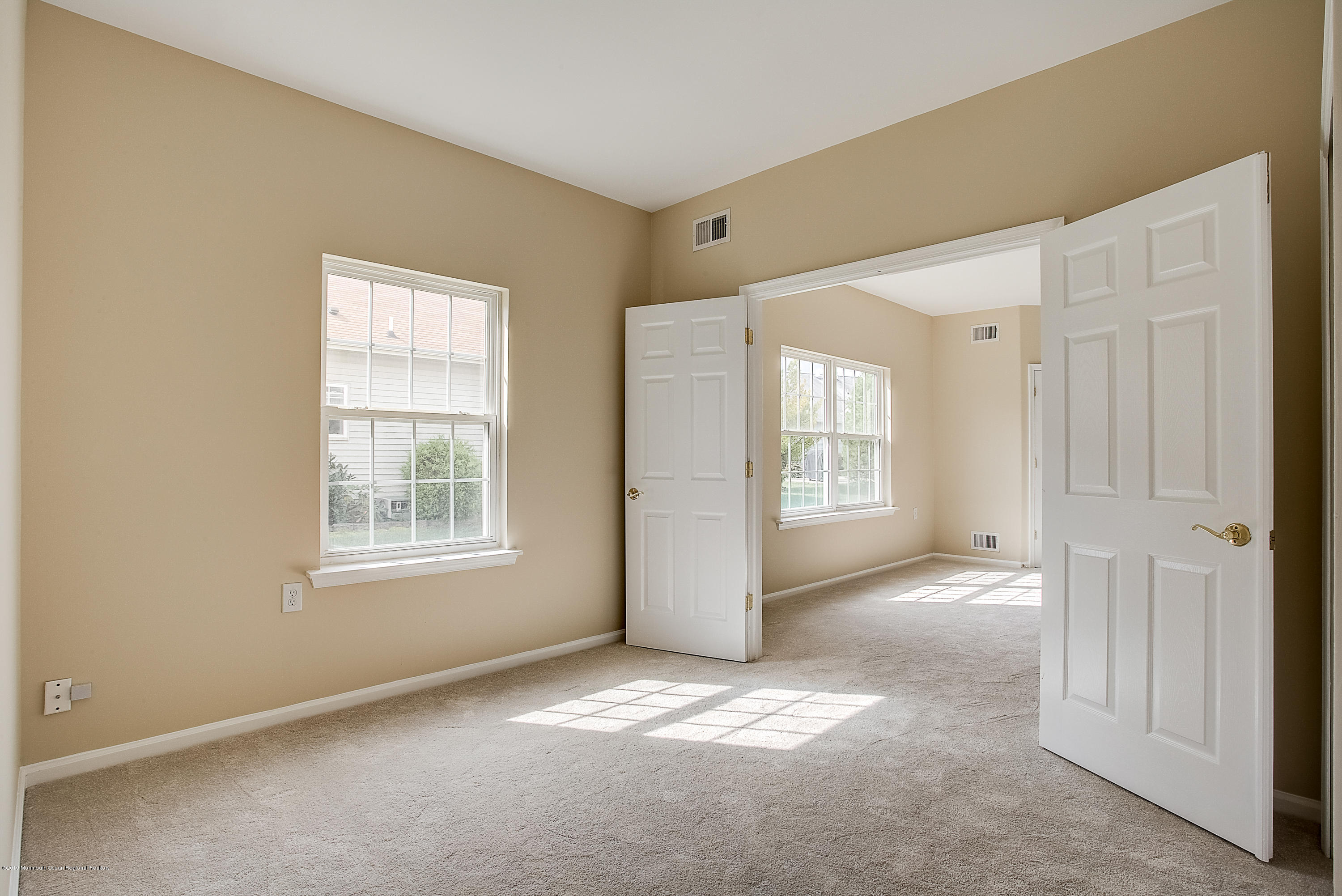 25 Torino Road Manchester Township, NJ 08759 - Photo 19 of 31 an empty room with windows