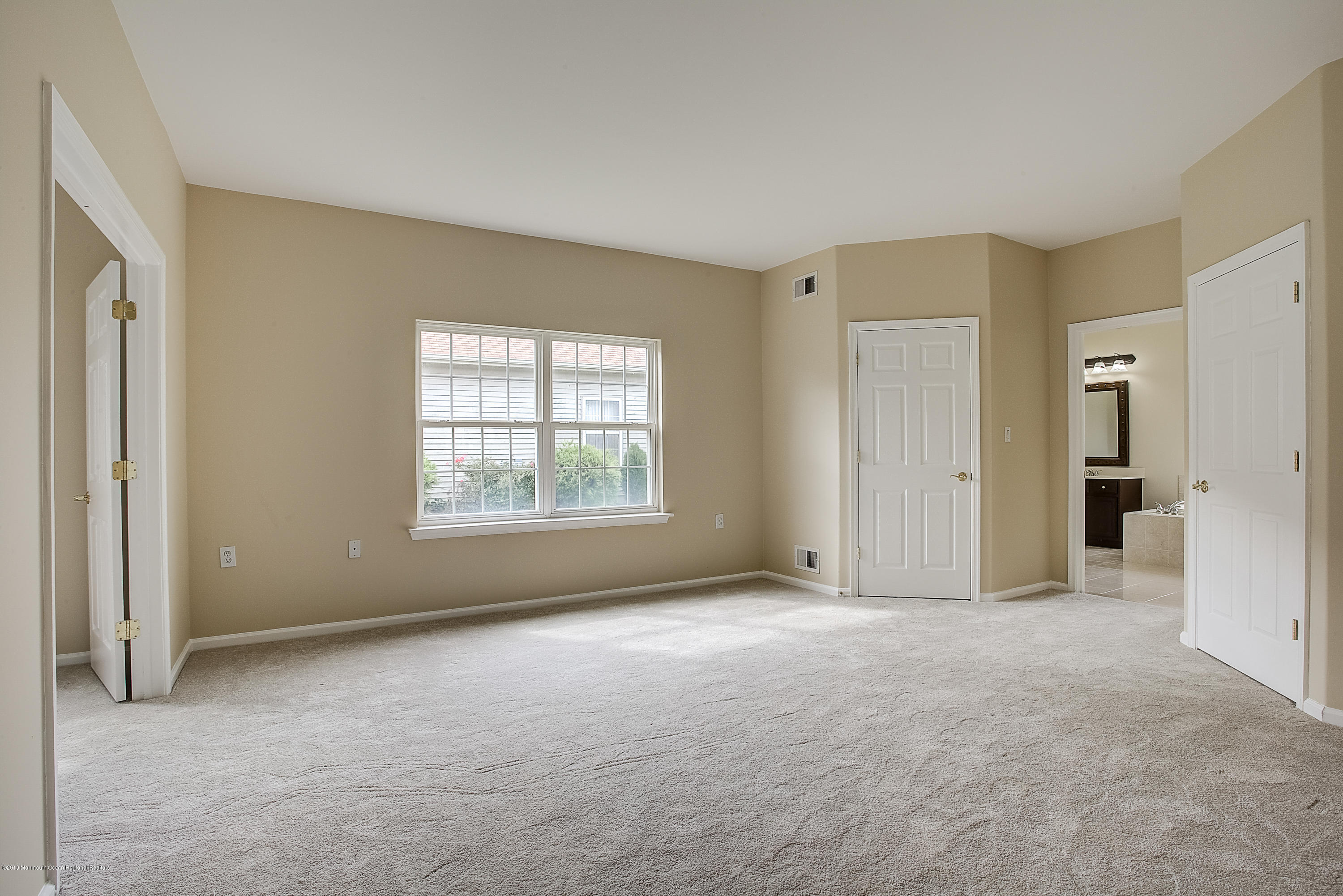 25 Torino Road Manchester Township, NJ 08759 - Photo 21 of 31 a view of an empty room with a window