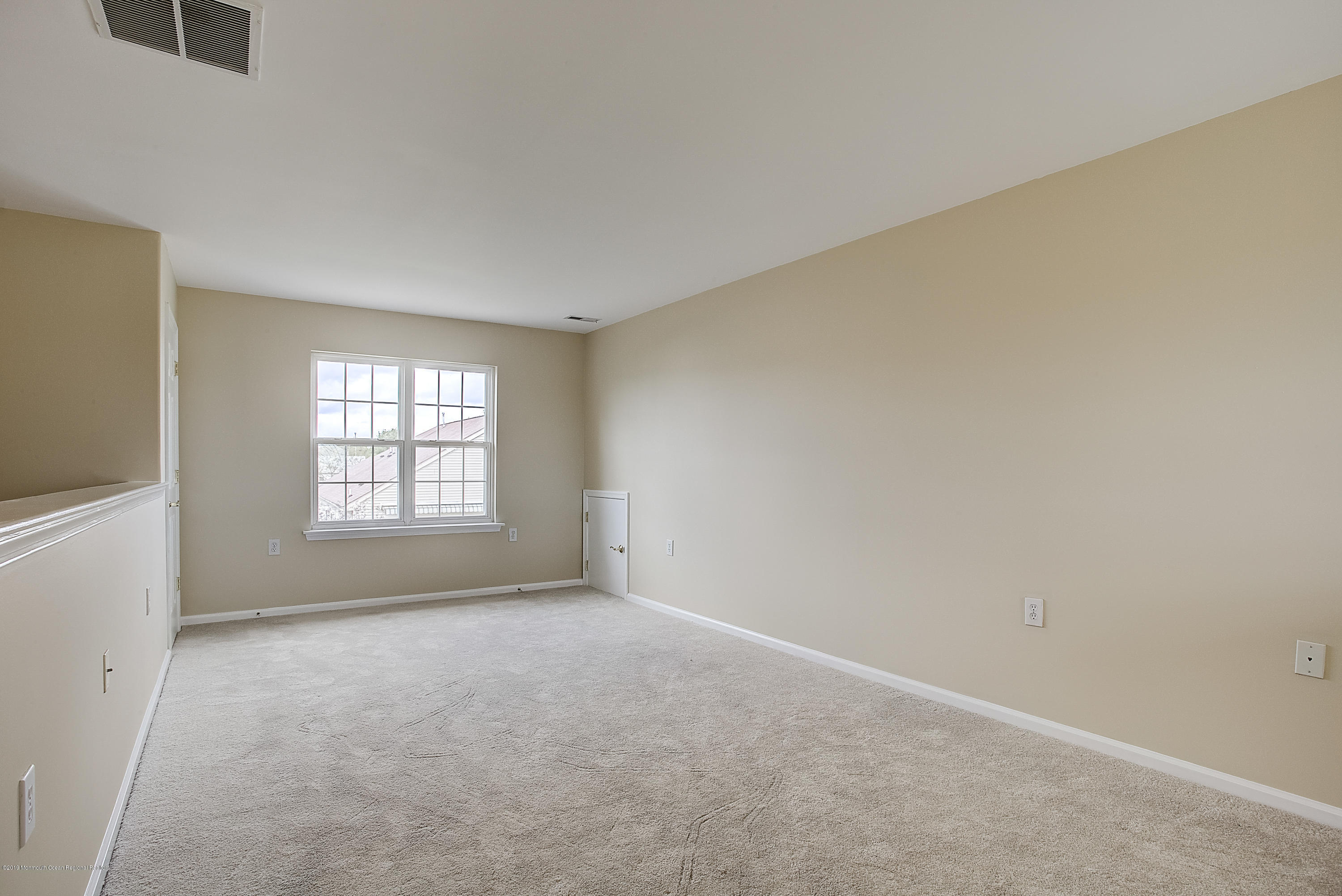 25 Torino Road Manchester Township, NJ 08759 - Photo 25 of 31 an empty room with a empty space and windows