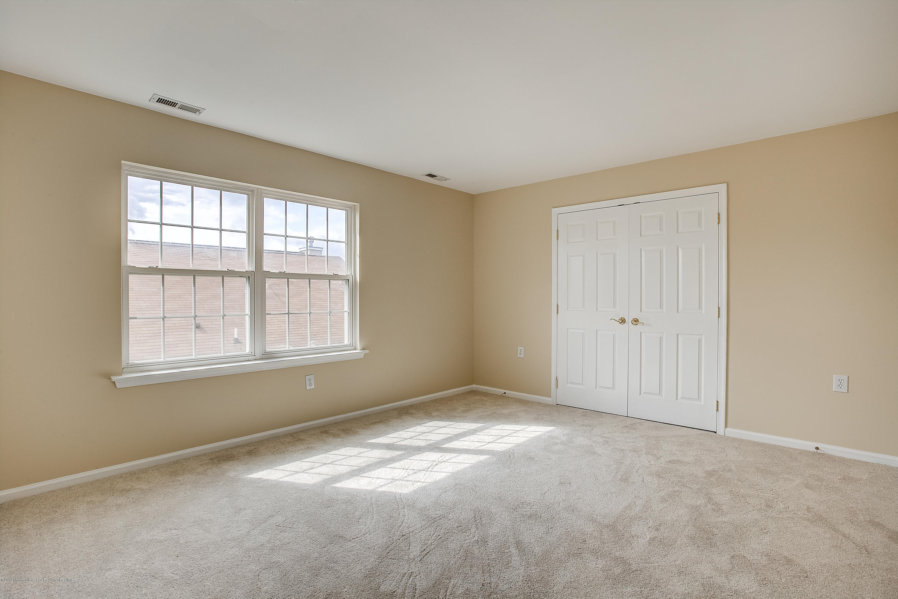 25 Torino Road Manchester Township, NJ 08759 - Photo 28 of 31 an empty room with windows