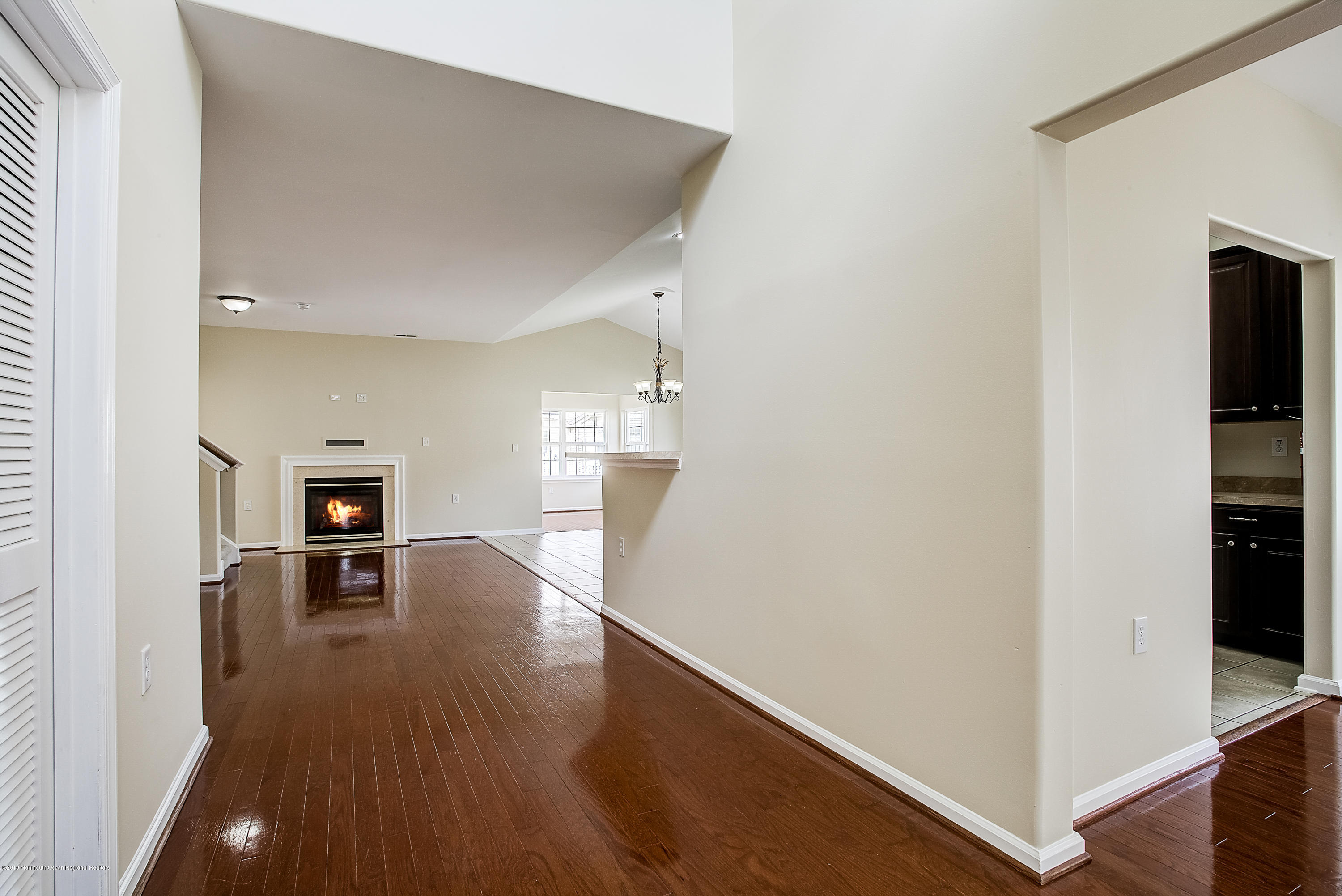 25 Torino Road Manchester Township, NJ 08759 - Photo 4 of 31 wooden floor in an empty room with a window
