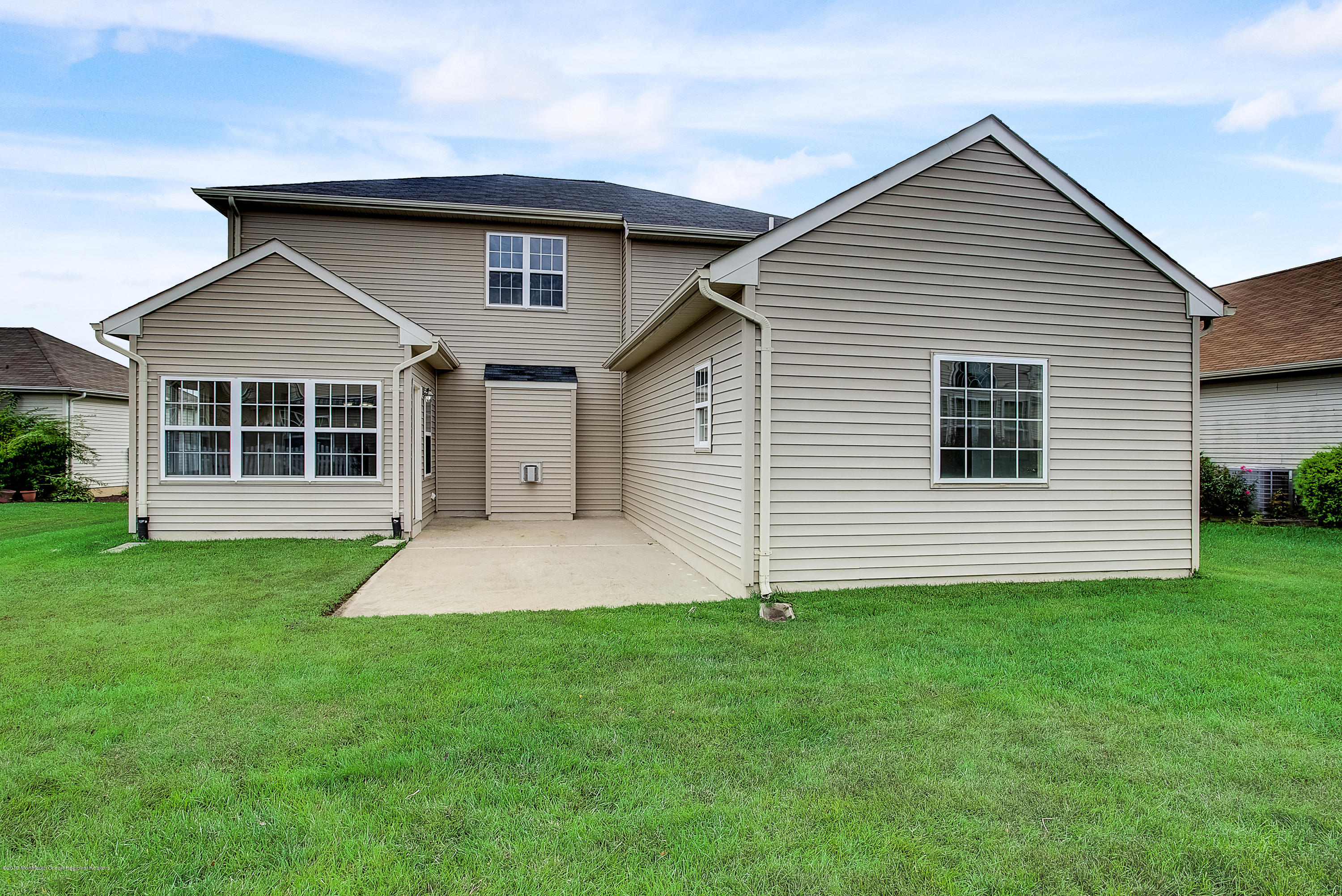 25 Torino Road Manchester Township, NJ 08759 - Photo 31 of 31 a front view of a house with a yard