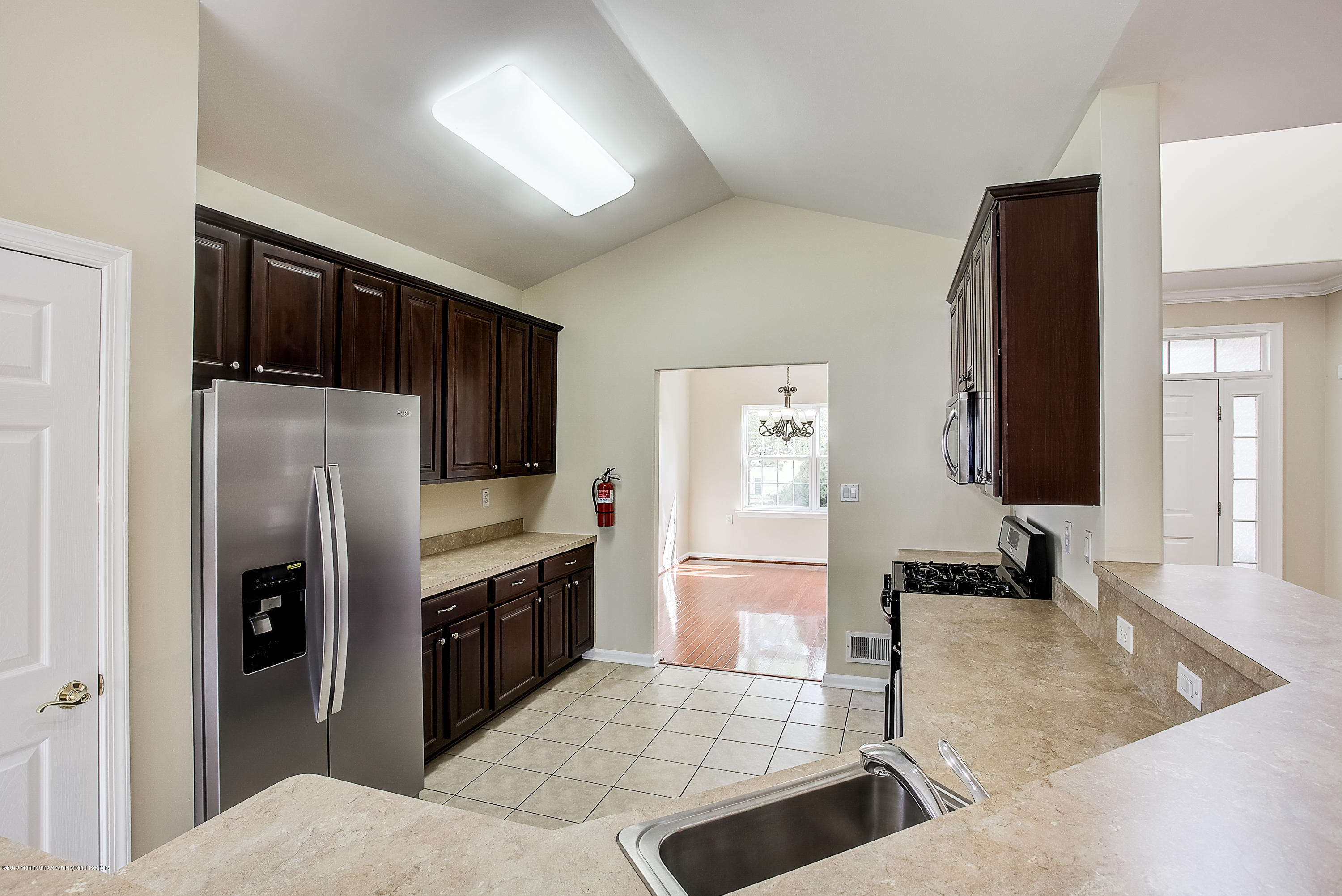 25 Torino Road Manchester Township, NJ 08759 - Photo 8 of 31 a kitchen with stainless steel appliances granite countertop a refrigerator and a stove