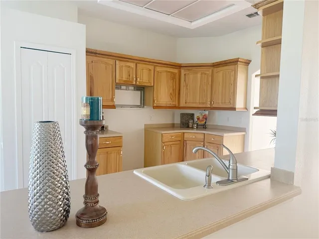 a kitchen with a sink and cabinets