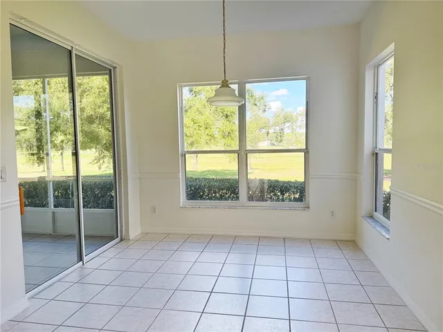 a view of a kitchen with a sink and a refrigerator