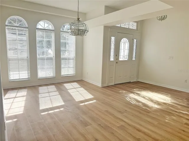 a view of entryway with wooden floor and window