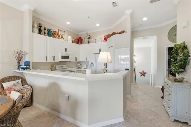 a living room with furniture and a large mirror