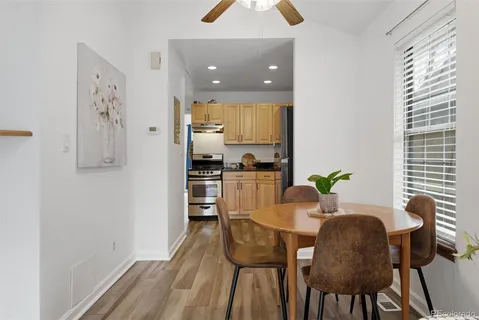 a view of a dining room with furniture and a window