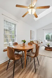 a view of a dining room with furniture window and wooden floor