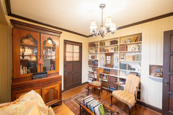 a view of balcony with wooden floor and furniture