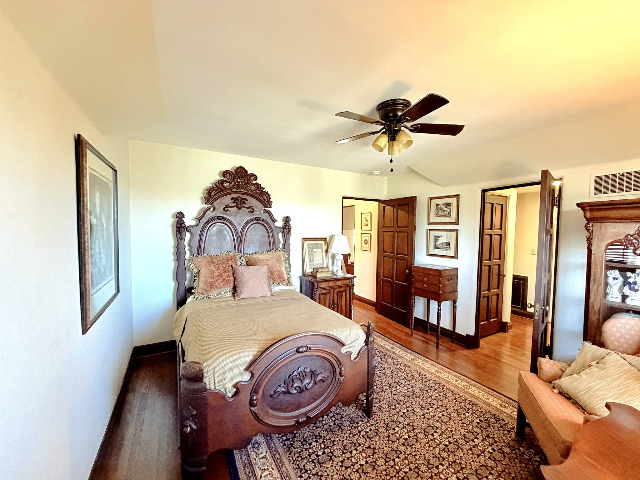 226 Rose Street Pulaski, TN 38478 - Photo 15 of 51 a bedroom with furniture and a chandelier