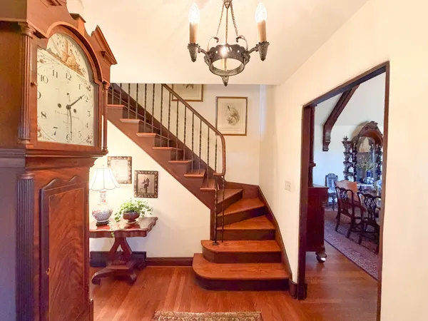 a view of entryway and hall with wooden floor
