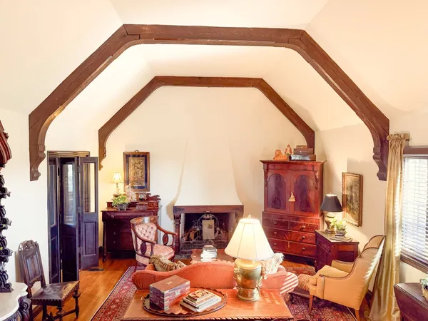 a living room with furniture and a fireplace