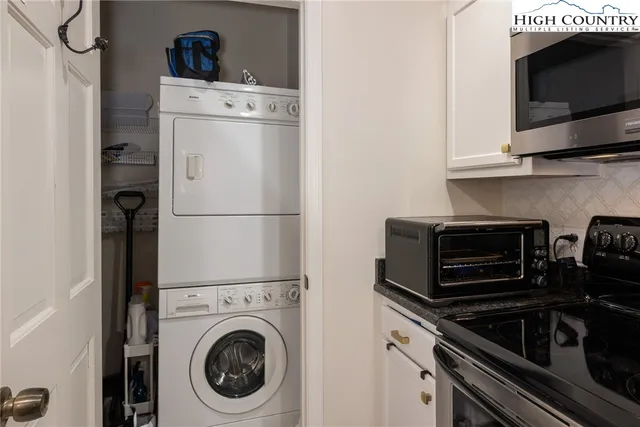 a kitchen with a stove and a microwave
