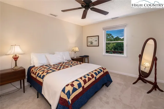 a bedroom with bed and a window