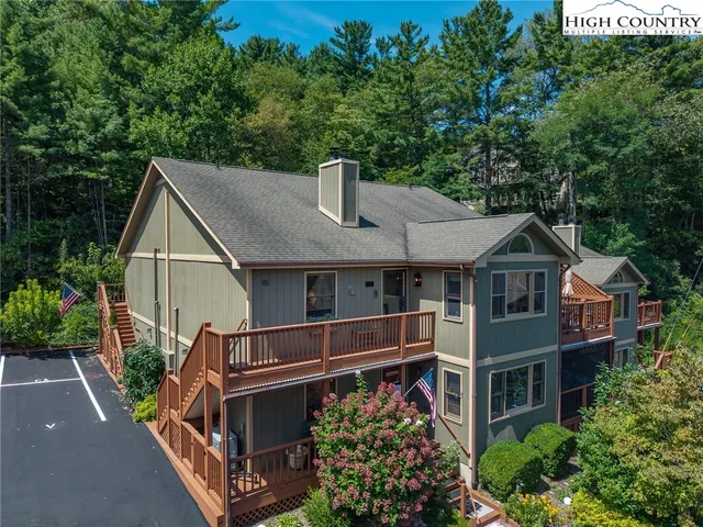 an aerial view of a house with roof deck
