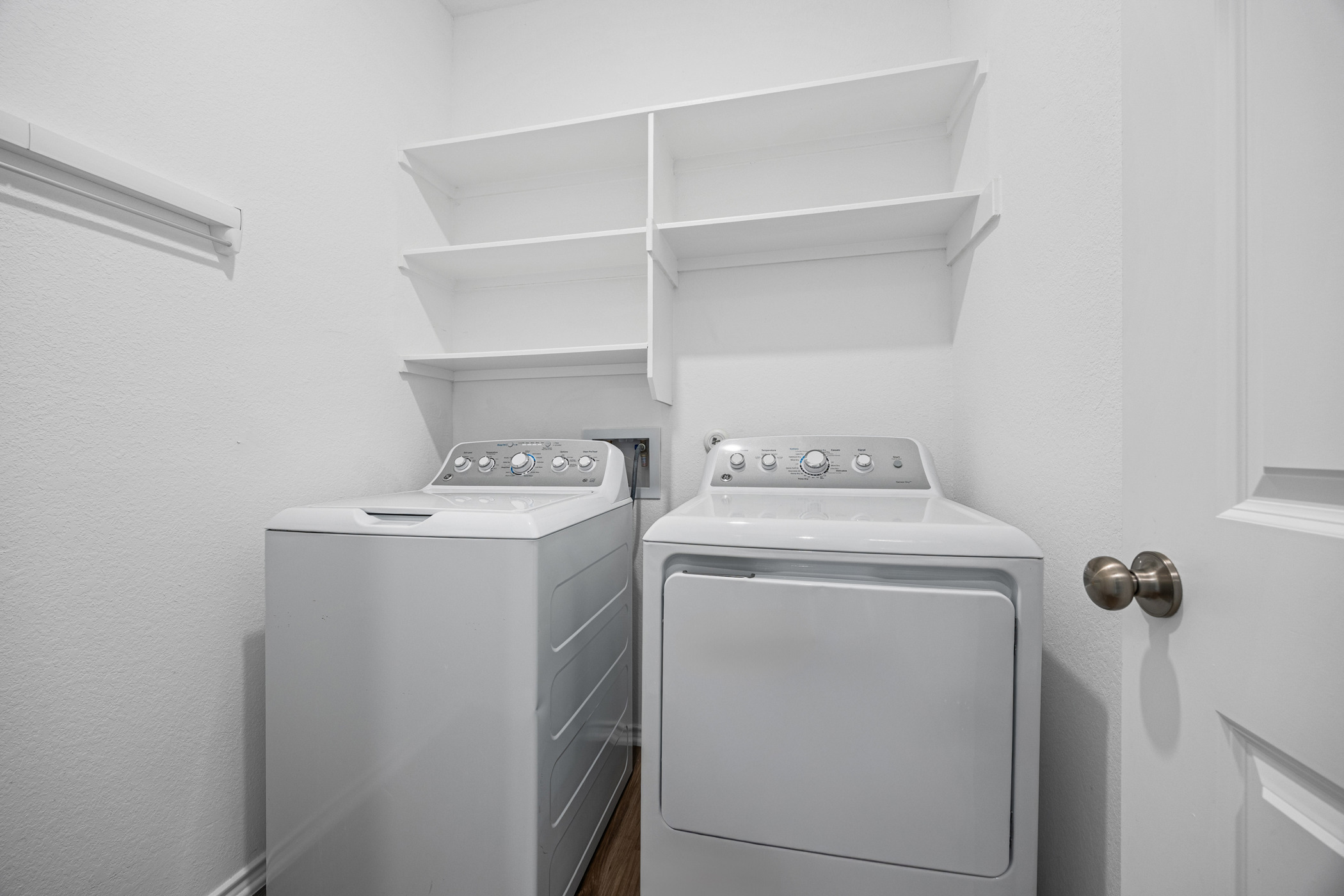 1609 Woolsey Way Leander, TX 78641 - Photo 17 of 29 a utility room with dryer and washer