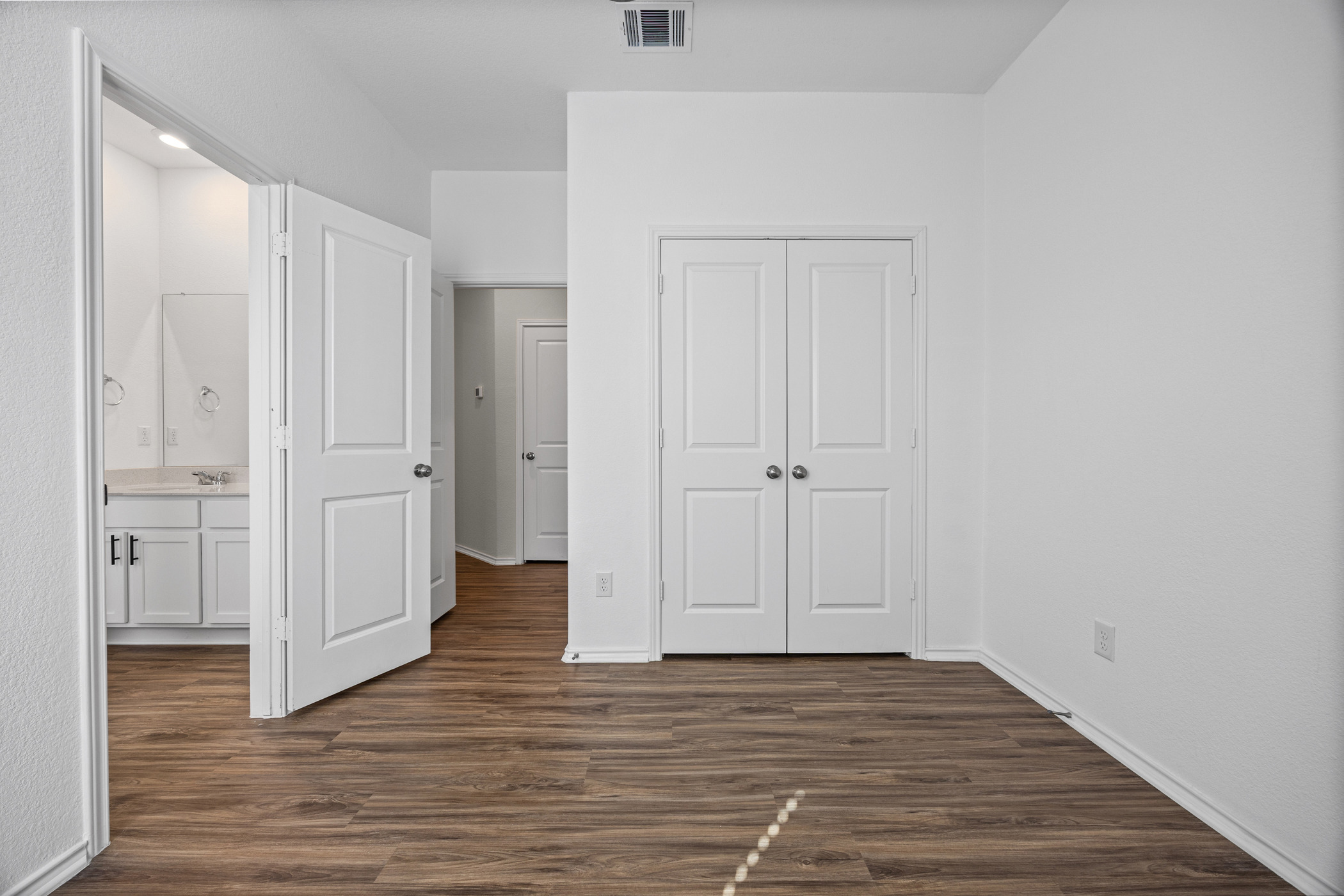 1609 Woolsey Way Leander, TX 78641 - Photo 19 of 29 a view of an empty room with wooden floor and closet