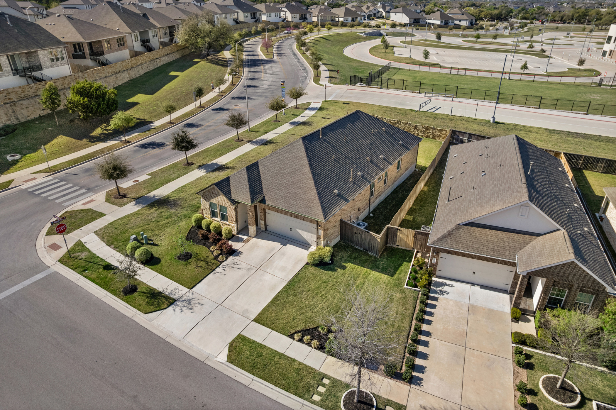 1609 Woolsey Way Leander, TX 78641 - Photo 26 of 29 an aerial view of a house with a garden and lake view
