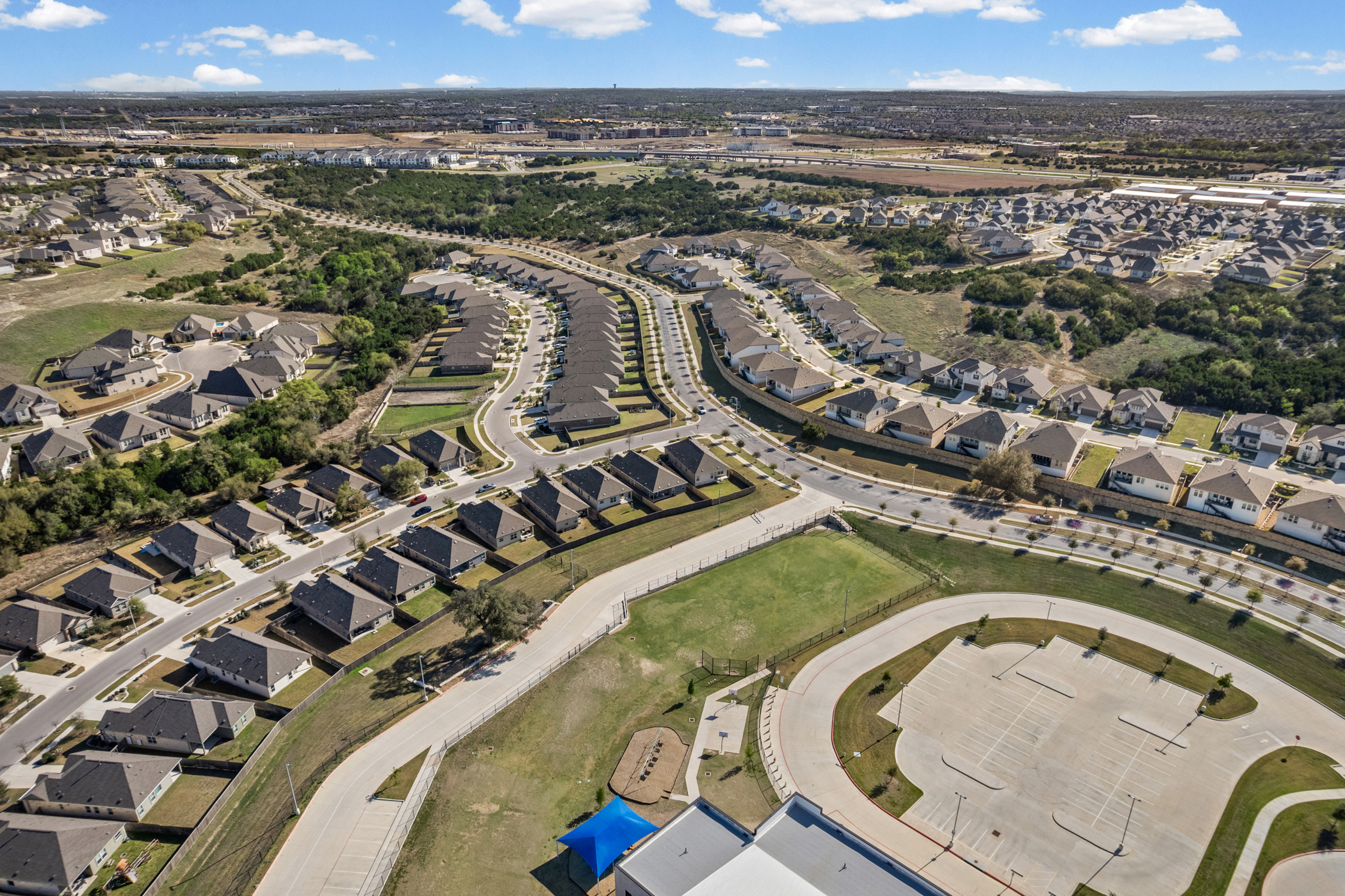 1609 Woolsey Way Leander, TX 78641 - Photo 27 of 29 an aerial view of a house with a lake view
