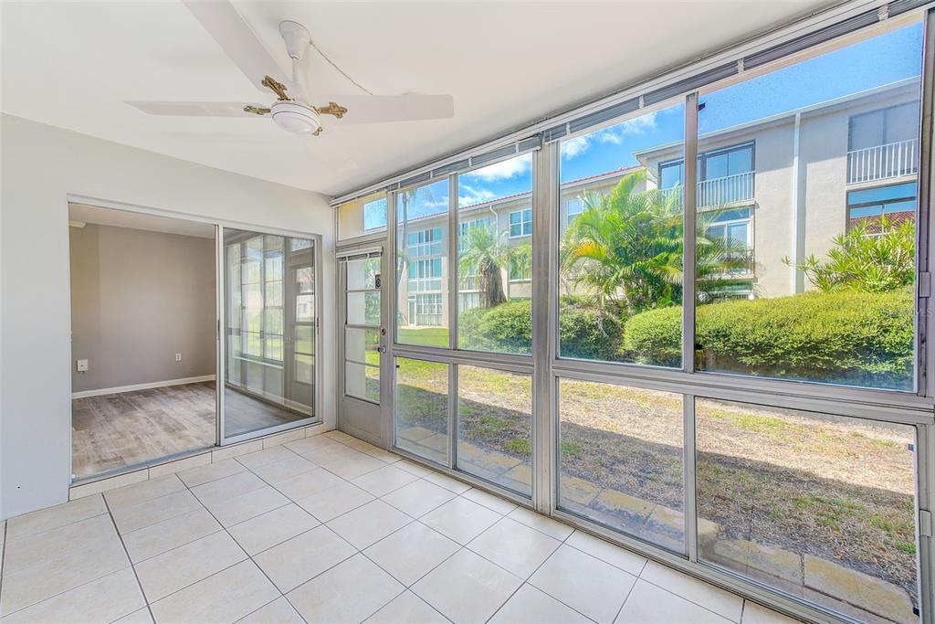 10280 Imperial Point Drive West, Unit 7 Largo, FL 33774 - Photo 14 of 67 a view of an empty room and window ceiling fan
