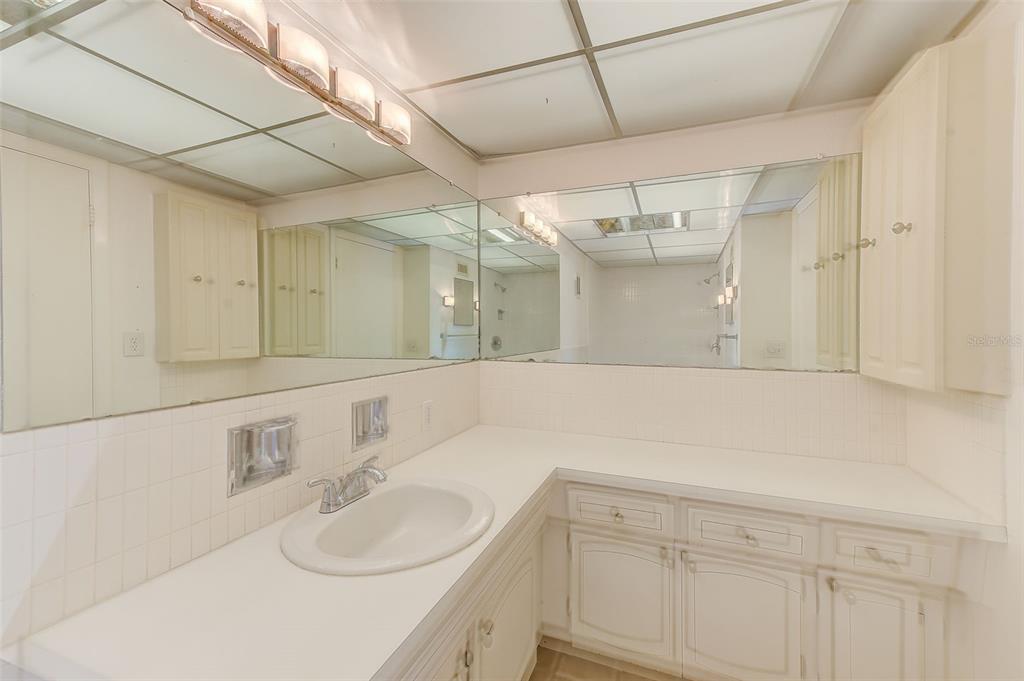 10280 Imperial Point Drive West, Unit 7 Largo, FL 33774 - Photo 27 of 67 a bathroom with a sink vanity and a mirror