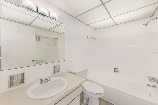 a view of an empty room and a window