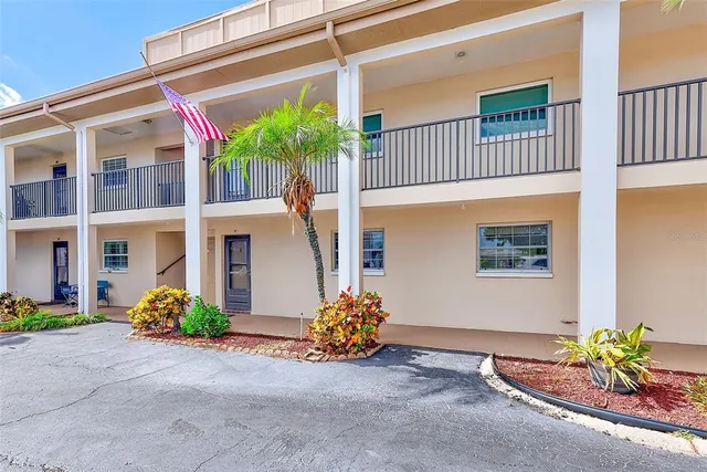 a view of a city with lots of residential buildings ocean and mountain view