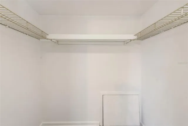 front view of a brick house with a large windows