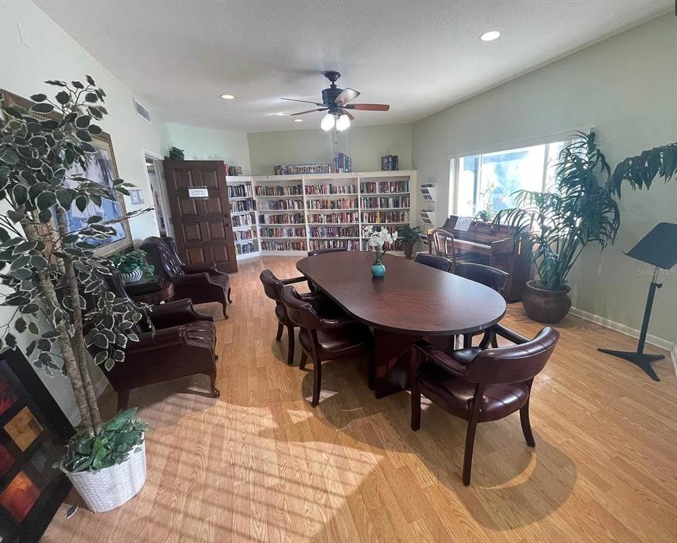 10280 Imperial Point Drive West, Unit 7 Largo, FL 33774 - Photo 53 of 67 a view of a dining room with furniture and chandelier