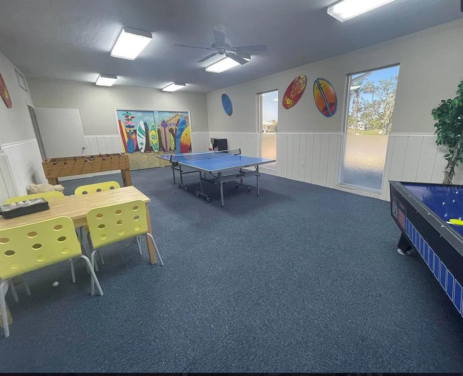 10280 Imperial Point Drive West, Unit 7 Largo, FL 33774 - Photo 57 of 67 a living room with furniture and a flat screen tv