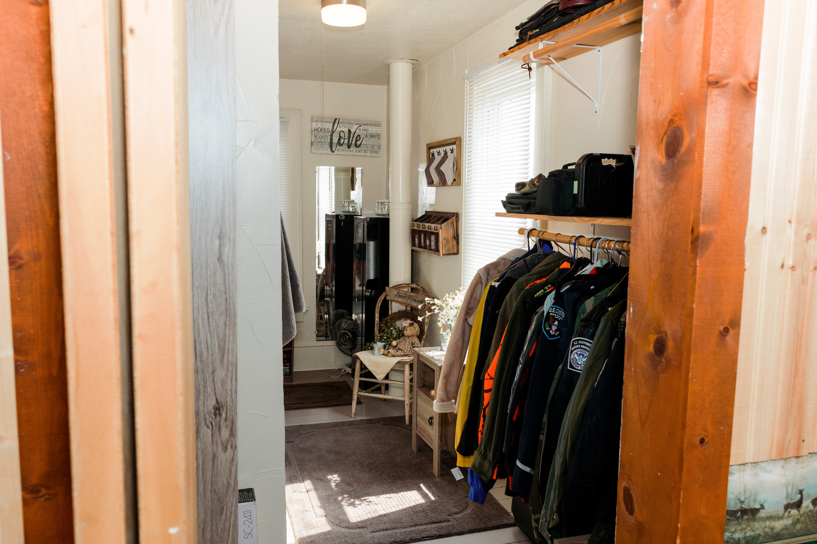 9768 Burns Road Fenton, IL 61251 - Photo 21 of 24 a view of walk in closet with clothes and shoes