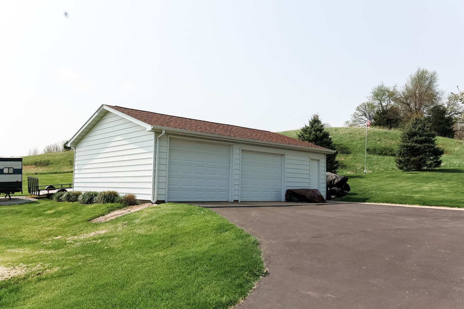 9768 Burns Road Fenton, IL 61251 - Photo 23 of 24 a backyard of a house with potted plants and large tree