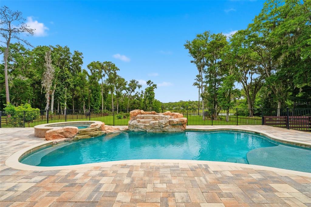 855 Southeast 87th Street Ocala, FL 34480 - Photo 60 of 79 a view of a swimming pool with a yard