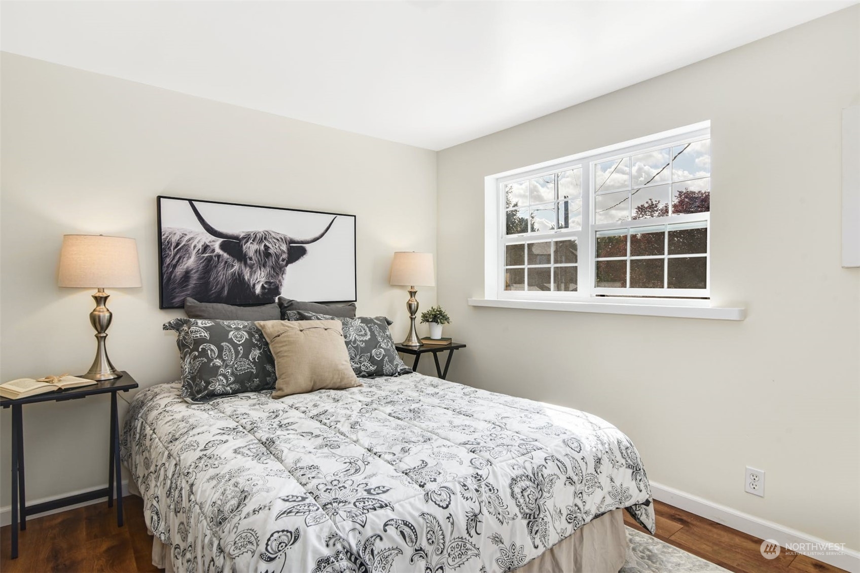 469 Maple Avenue Southwest Renton, WA 98057 - Photo 12 of 30 a bedroom with a bed and wooden floor