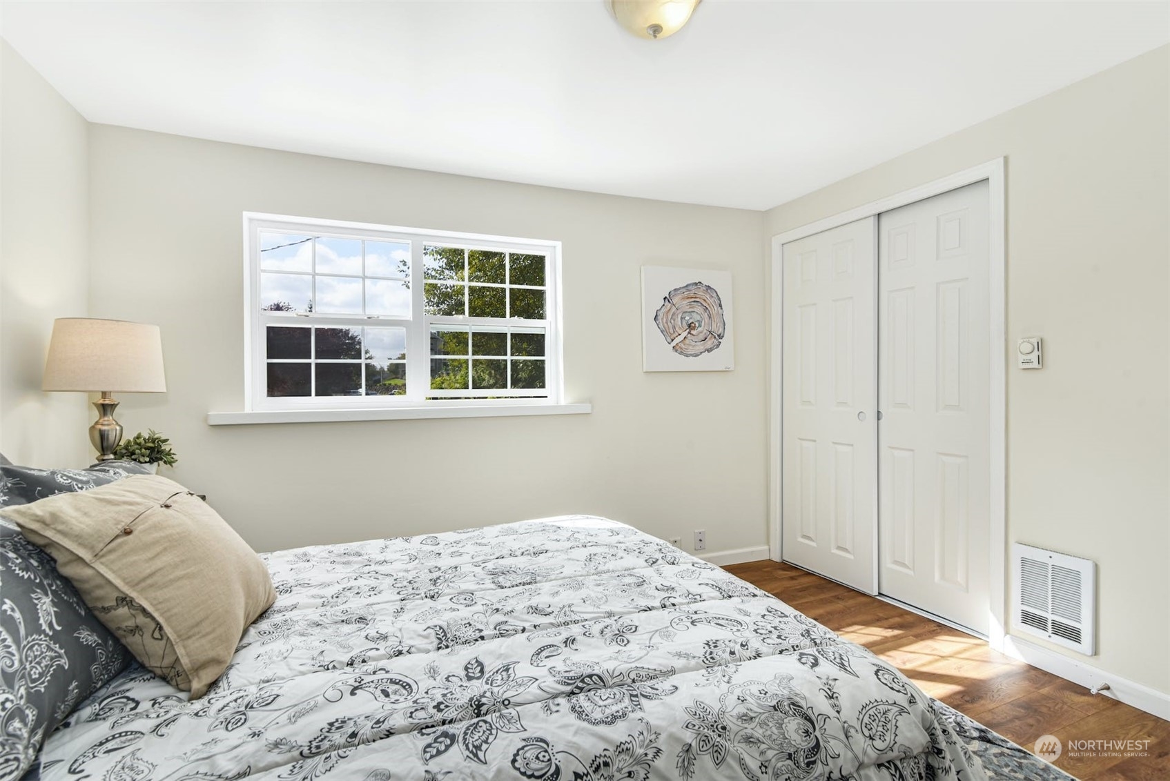 469 Maple Avenue Southwest Renton, WA 98057 - Photo 14 of 30 a bedroom with a bed and a window