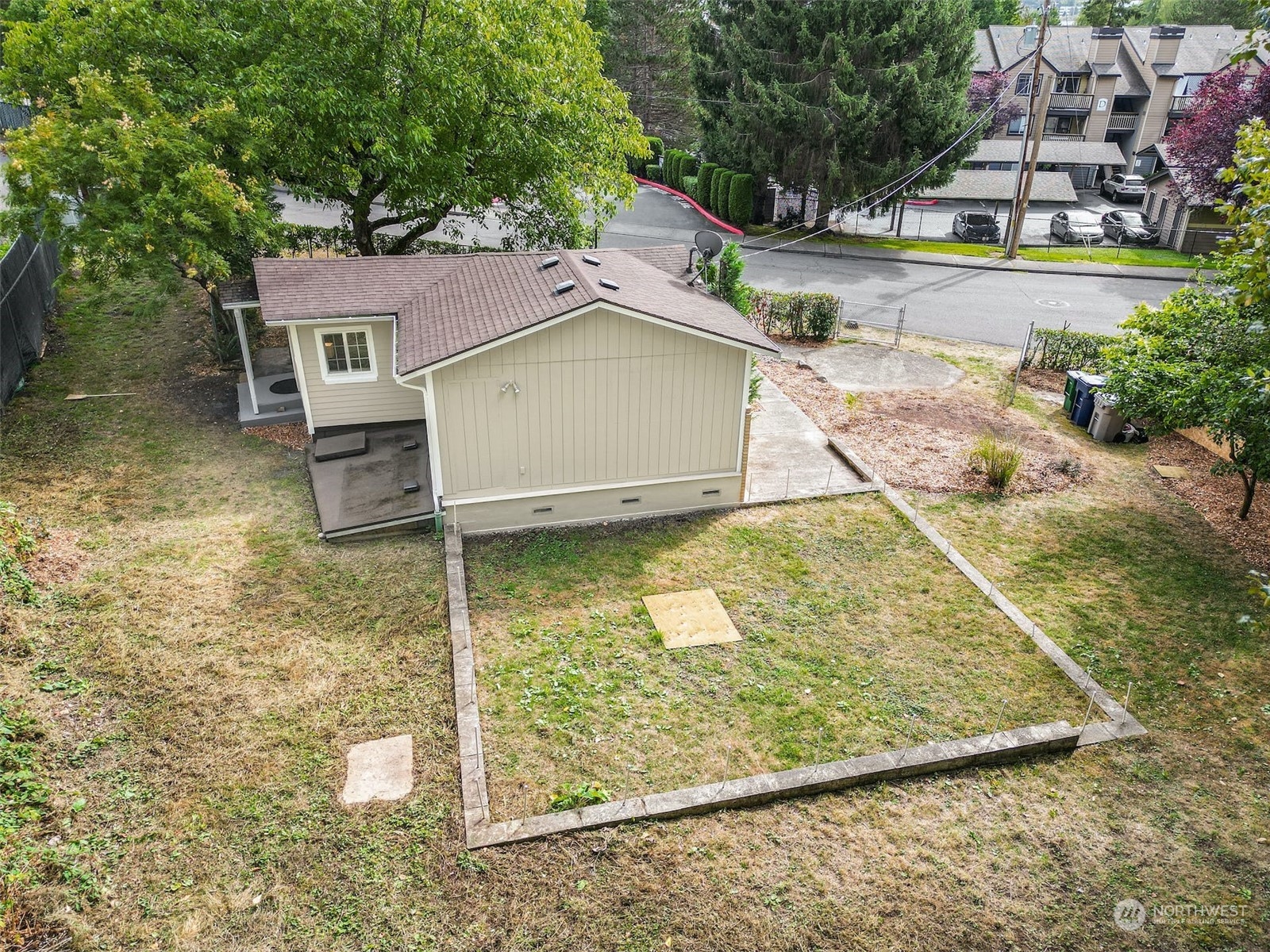 469 Maple Avenue Southwest Renton, WA 98057 - Photo 24 of 30 a view of a house with a yard