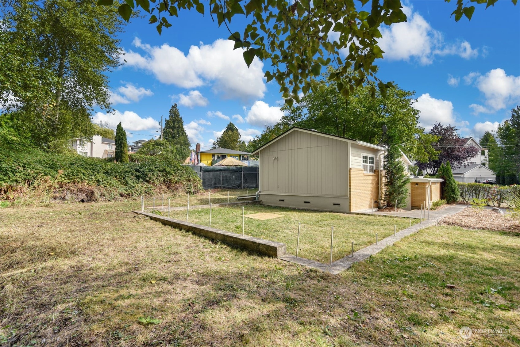 469 Maple Avenue Southwest Renton, WA 98057 - Photo 27 of 30 a view of a house with a yard and garage