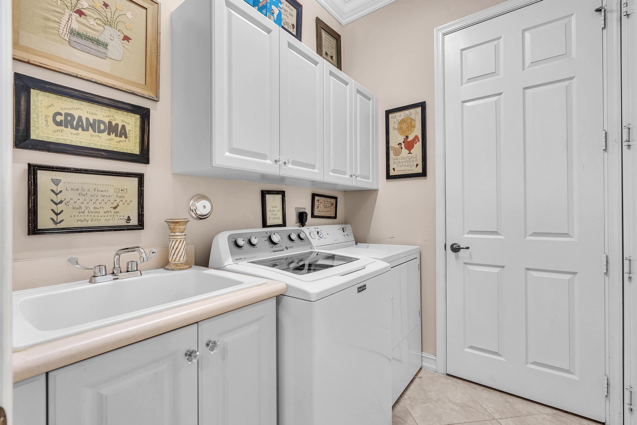 9062 Meridian View Isle Boynton Beach, FL 33473 - Photo 14 of 71 a bathroom with a sink and a mirror