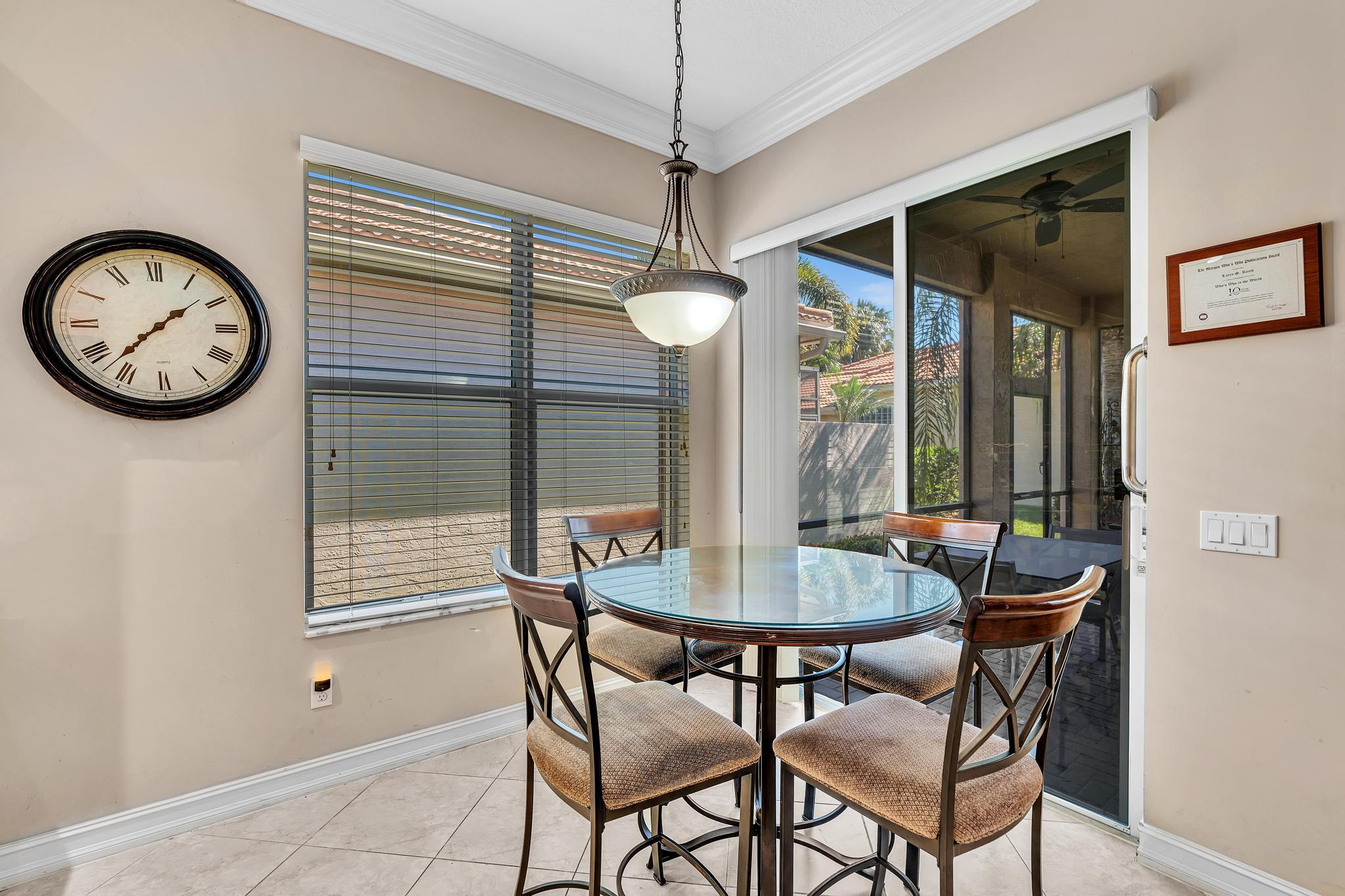9062 Meridian View Isle Boynton Beach, FL 33473 - Photo 27 of 71 a dining room with furniture and window