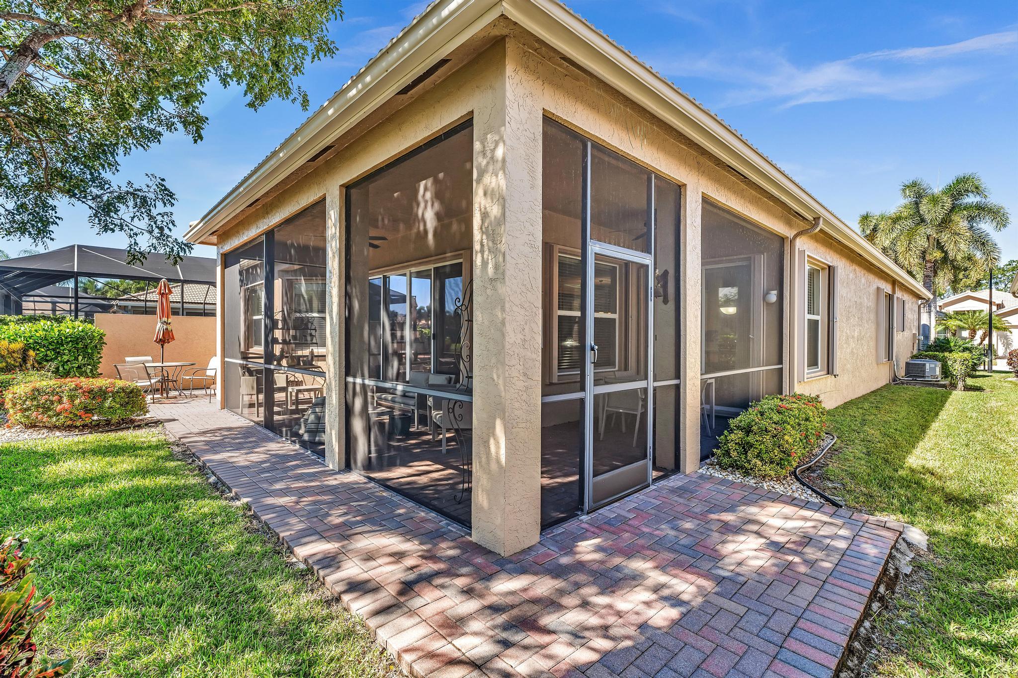 9062 Meridian View Isle Boynton Beach, FL 33473 - Photo 40 of 71 a view of a house with a yard