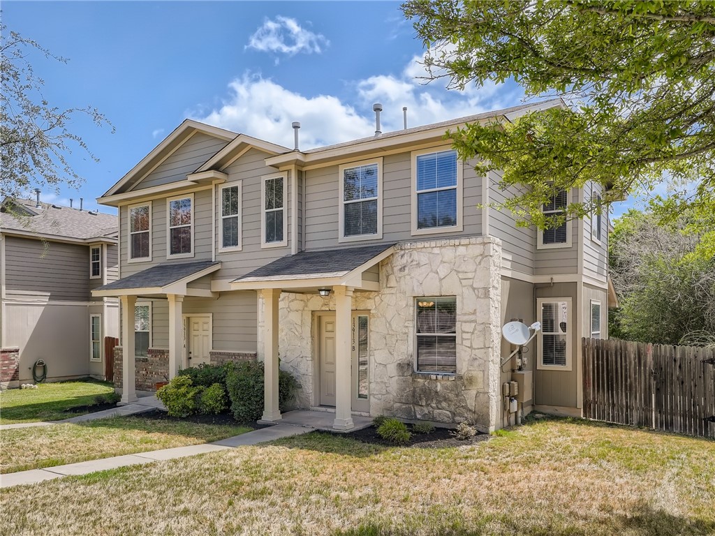 13913 Harris Ridge Boulevard, Unit B Pflugerville, TX 78660 - Photo 1 of 25 a front view of a house with garden