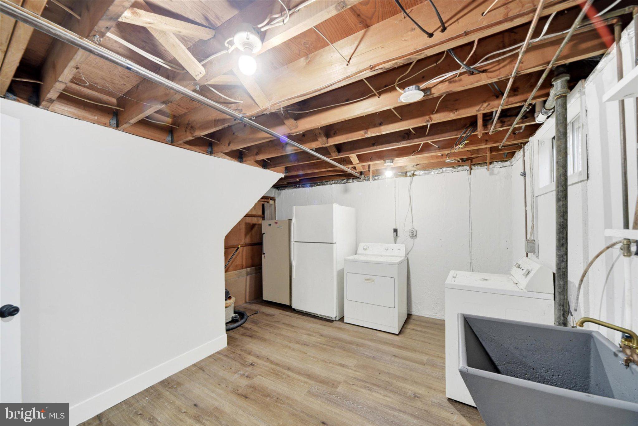 3709 Lamoine Road Randallstown, MD 21133 - Photo 23 of 25 Spacious, unfinished basement laundry area.