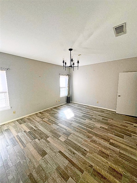 4001 Tanglewilde Street, Unit 1203 Houston, TX 77063 - Photo 11 of 14 a view of empty room with wooden floor and fan