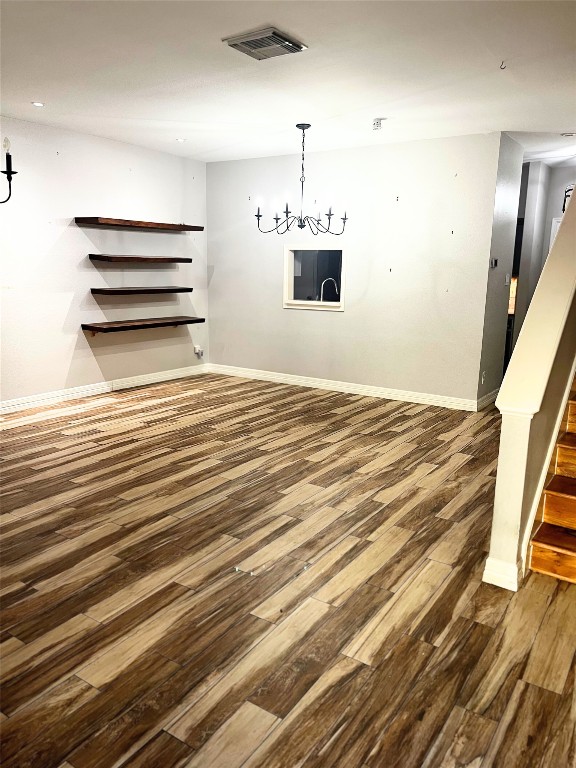 4001 Tanglewilde Street, Unit 1203 Houston, TX 77063 - Photo 4 of 14 a view of empty room with wooden floor