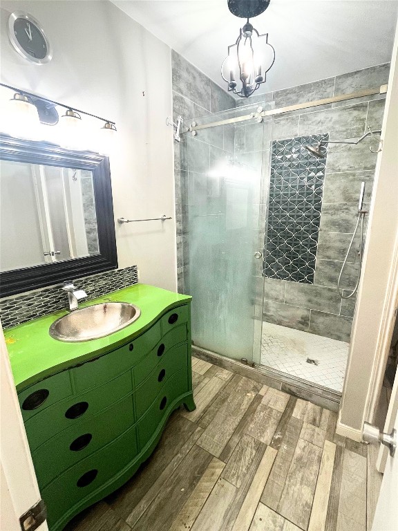 4001 Tanglewilde Street, Unit 1203 Houston, TX 77063 - Photo 6 of 14 a bathroom with a sink a mirror and a shower