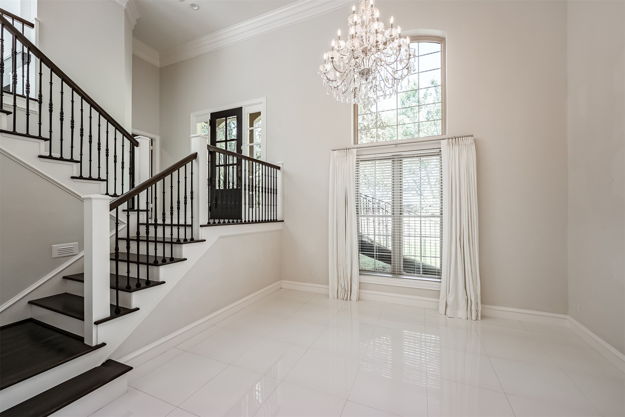 a view of an entryway with wooden floor
