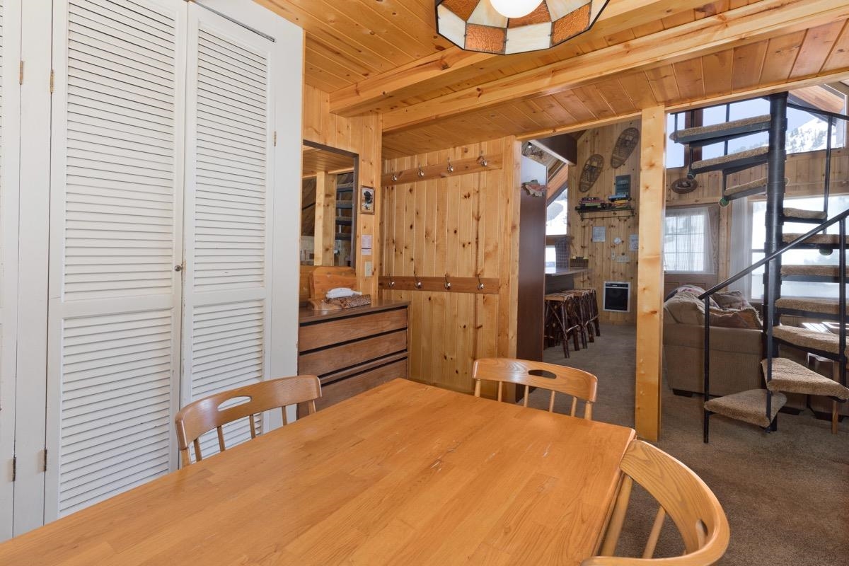 11000 Minaret Road, Unit 2 Mammoth Lakes, CA 93546 - Photo 25 of 31 a bedroom with a bed and wooden floor