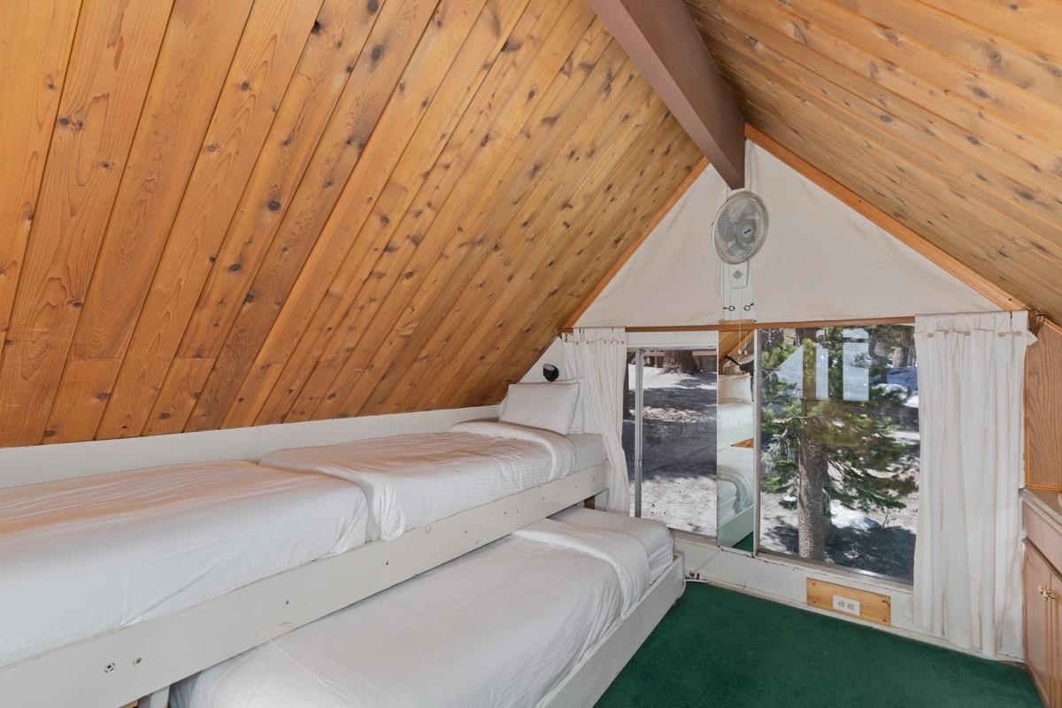 11000 Minaret Road, Unit 2 Mammoth Lakes, CA 93546 - Photo 29 of 31 a bedroom with a bed and a window